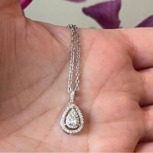 The Decadent Drop Moissanite teardrop pendant on 925 silver chain.